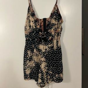 LF black/brown romper. Size small, fits smaller. Never worn, too small for me.